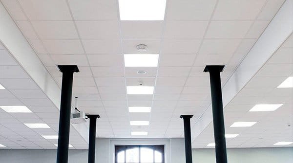 Bright commercial interior with restored white acoustic ceiling tiles